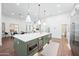Open-concept kitchen with an island, built-in appliances, and sleek cabinetry at 2251 N 32Nd St # 10, Mesa, AZ 85213