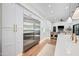 Bright kitchen featuring stainless steel appliances, white cabinetry, and light wood flooring at 2251 N 32Nd St # 10, Mesa, AZ 85213