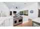Gourmet kitchen with stainless steel appliances and an island with a cooktop at 2251 N 32Nd St # 10, Mesa, AZ 85213