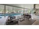 Indoor pool with lounge chairs, ample natural light, and comfortable seating arrangement at 2251 N 32Nd St # 10, Mesa, AZ 85213