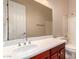 Bathroom featuring a vanity with a white countertop, a shower and a large mirror at 2263 E Jade Ct, Chandler, AZ 85286