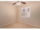 Bedroom with tiled floor, ceiling fan, and a window with white shutters at 2263 E Jade Ct, Chandler, AZ 85286