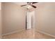Bedroom featuring tile flooring, ceiling fan and access to other rooms at 2263 E Jade Ct, Chandler, AZ 85286