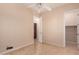 Bedroom featuring tile flooring, open closet and access to additional room at 2263 E Jade Ct, Chandler, AZ 85286