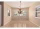 Dining area with chandelier and large windows providing lots of natural light at 2263 E Jade Ct, Chandler, AZ 85286