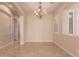 Empty dining room area with chandelier, and large windows providing natural light at 2263 E Jade Ct, Chandler, AZ 85286