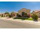 Tan single story home with desert landscaping, shade trees and a 2 car garage at 2263 E Jade Ct, Chandler, AZ 85286