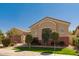 Tan single story home with desert landscaping, shade trees and a 2 car garage at 2263 E Jade Ct, Chandler, AZ 85286