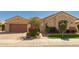 Charming single-story home with well-manicured landscaping and a two-car garage at 2263 E Jade Ct, Chandler, AZ 85286