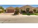 Charming single-story home with well-manicured landscaping and a two-car garage at 2263 E Jade Ct, Chandler, AZ 85286