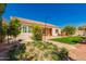 Charming single-story home with well-maintained landscaping, stone walkway, and appealing exterior at 2263 E Jade Ct, Chandler, AZ 85286
