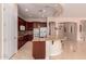 Gourmet kitchen featuring granite countertops, island with seating, and modern stainless steel appliances at 2263 E Jade Ct, Chandler, AZ 85286