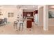 Spacious kitchen featuring granite countertops, island with seating, and modern stainless steel appliances at 2263 E Jade Ct, Chandler, AZ 85286