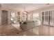 Open-concept living room with tile floors and large windows with views of the backyard at 2263 E Jade Ct, Chandler, AZ 85286