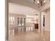 Spacious living room with kitchen and large sliding glass doors provide lots of natural light at 2263 E Jade Ct, Chandler, AZ 85286