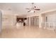 Spacious open floor plan with tile flooring, ceiling fan, and a view of the modern kitchen at 2263 E Jade Ct, Chandler, AZ 85286