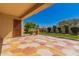 Covered patio with patterned concrete, a privacy door, and landscaping at 2263 E Jade Ct, Chandler, AZ 85286