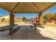 Community picnic area under a covered structure, featuring tables, with a playground nearby at 2263 E Jade Ct, Chandler, AZ 85286
