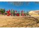 Community playground with colorful play structures, shade, and nearby walking trails at 2263 E Jade Ct, Chandler, AZ 85286