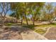 Scenic community walking path lined with mature trees and well-maintained landscaping at 2263 E Jade Ct, Chandler, AZ 85286