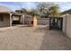 Low maintenance backyard featuring gravel landscaping, a covered patio, and privacy fencing at 24638 N 65Th Ave, Glendale, AZ 85310