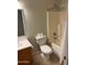 Bathroom featuring a toilet, a tub/shower combo and a vanity with white sink at 24638 N 65Th Ave, Glendale, AZ 85310