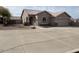 Charming single-story home with a well-manicured yard and a spacious driveway at 24638 N 65Th Ave, Glendale, AZ 85310