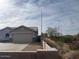 Well maintained desert property with a single story home, desert foliage and low block wall at 24638 N 65Th Ave, Glendale, AZ 85310