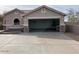Spacious garage with an open entrance and neutral concrete floor at 24638 N 65Th Ave, Glendale, AZ 85310