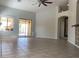 Open-plan living area with sliding glass doors leading to the outdoor space at 24638 N 65Th Ave, Glendale, AZ 85310