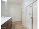 Bathroom featuring a dark wood vanity with a white countertop and a glass-enclosed shower at 2663 S Equestrian Dr # 106, Gilbert, AZ 85295