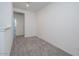 Minimalist bedroom featuring neutral carpet and natural light at 2663 S Equestrian Dr # 106, Gilbert, AZ 85295