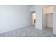 Well-lit bedroom with plush carpeting and views into the hallway and closet areas at 2663 S Equestrian Dr # 106, Gilbert, AZ 85295