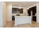 Modern kitchen featuring dark wood cabinetry and white quartz countertops at 2663 S Equestrian Dr # 106, Gilbert, AZ 85295