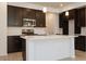 Well-lit kitchen with stainless steel appliances, quartz countertops, and an island at 2663 S Equestrian Dr # 106, Gilbert, AZ 85295