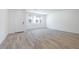 Bright living room featuring wood-look tile flooring and natural light at 2663 S Equestrian Dr # 106, Gilbert, AZ 85295