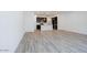 Open concept living area featuring wood-look tile flooring and neutral paint at 2663 S Equestrian Dr # 106, Gilbert, AZ 85295