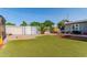 Artificial turf area with privacy fence, landscaping, and sitting area at 340 E Harwell Rd, Gilbert, AZ 85234