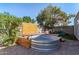 Backyard stock tank pool with wood decking and shade at 340 E Harwell Rd, Gilbert, AZ 85234