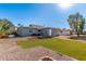 Backyard featuring gravel, artificial turf, patio and fire pit at 340 E Harwell Rd, Gilbert, AZ 85234