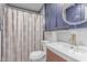 Bathroom featuring vanity, toilet, and tiled shower with curtain at 340 E Harwell Rd, Gilbert, AZ 85234