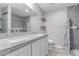 Modern bathroom featuring double vanity, granite countertop, and tiled shower at 340 E Harwell Rd, Gilbert, AZ 85234