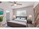 Comfortable bedroom features a ceiling fan, a window, and a modern bed frame at 340 E Harwell Rd, Gilbert, AZ 85234