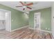 Spacious bedroom featuring modern ceiling fan, recessed lighting, and wood-look flooring at 340 E Harwell Rd, Gilbert, AZ 85234