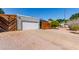 Attractive single-story home featuring desert landscaping, a gray exterior, and a two-car garage at 340 E Harwell Rd, Gilbert, AZ 85234