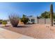 Attractive single-story home showcasing desert landscaping, a large saguaro cactus, and solar panels at 340 E Harwell Rd, Gilbert, AZ 85234