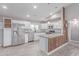 Bright kitchen boasting stainless steel appliances, a granite countertop island, and white subway tile at 340 E Harwell Rd, Gilbert, AZ 85234