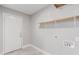 Laundry room with shelving, grey walls, and tile flooring at 340 E Harwell Rd, Gilbert, AZ 85234