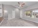 Spacious open-concept living area with light gray walls, wood-look floors, and ample natural light at 340 E Harwell Rd, Gilbert, AZ 85234