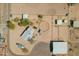 Aerial view of desert horse property featuring horse arenas and stalls at 35844 N 12Th St, Phoenix, AZ 85086